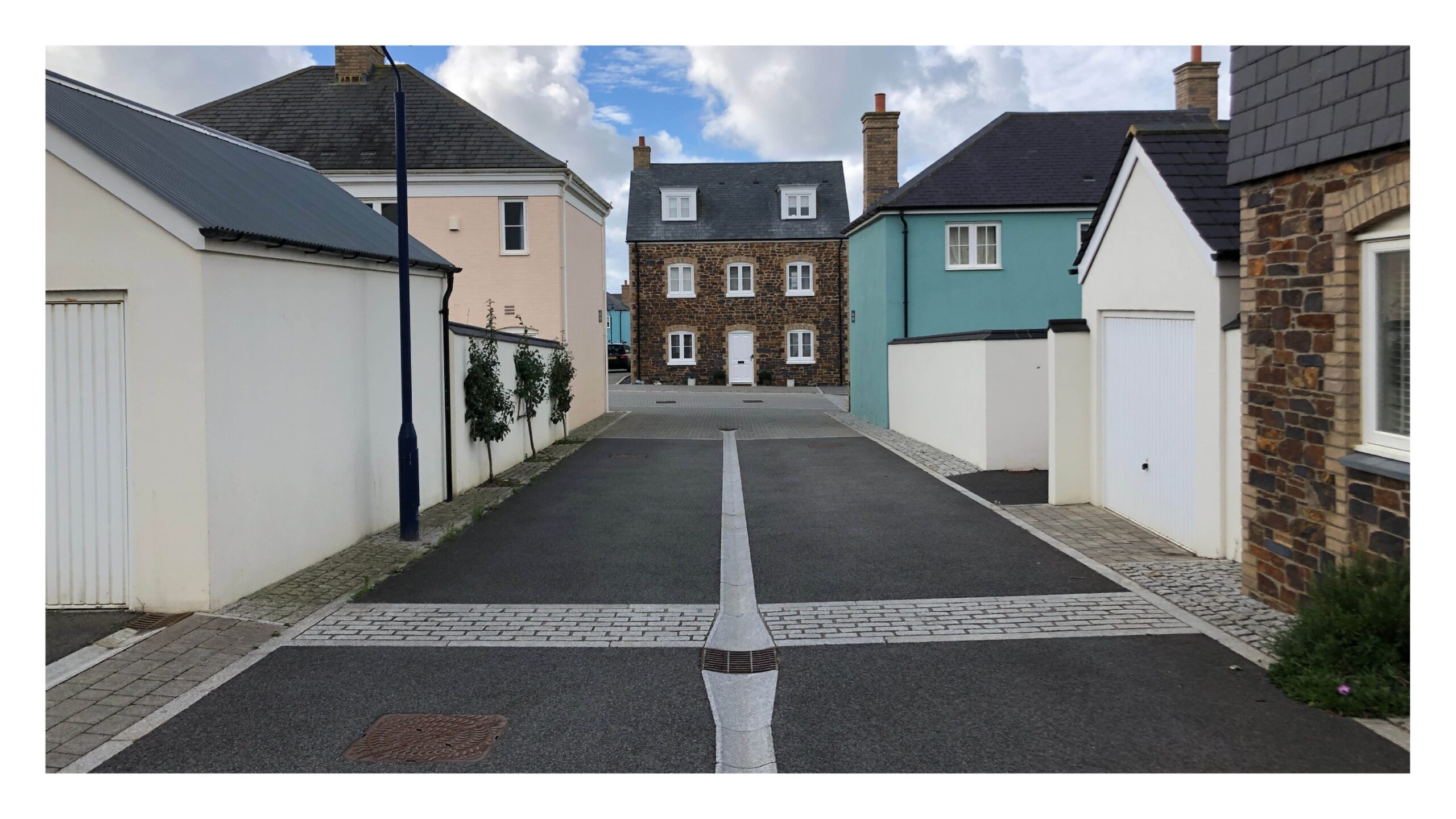 Sparing use of quality materials lifts the appearance of the street, Nansledan, Cornwall.