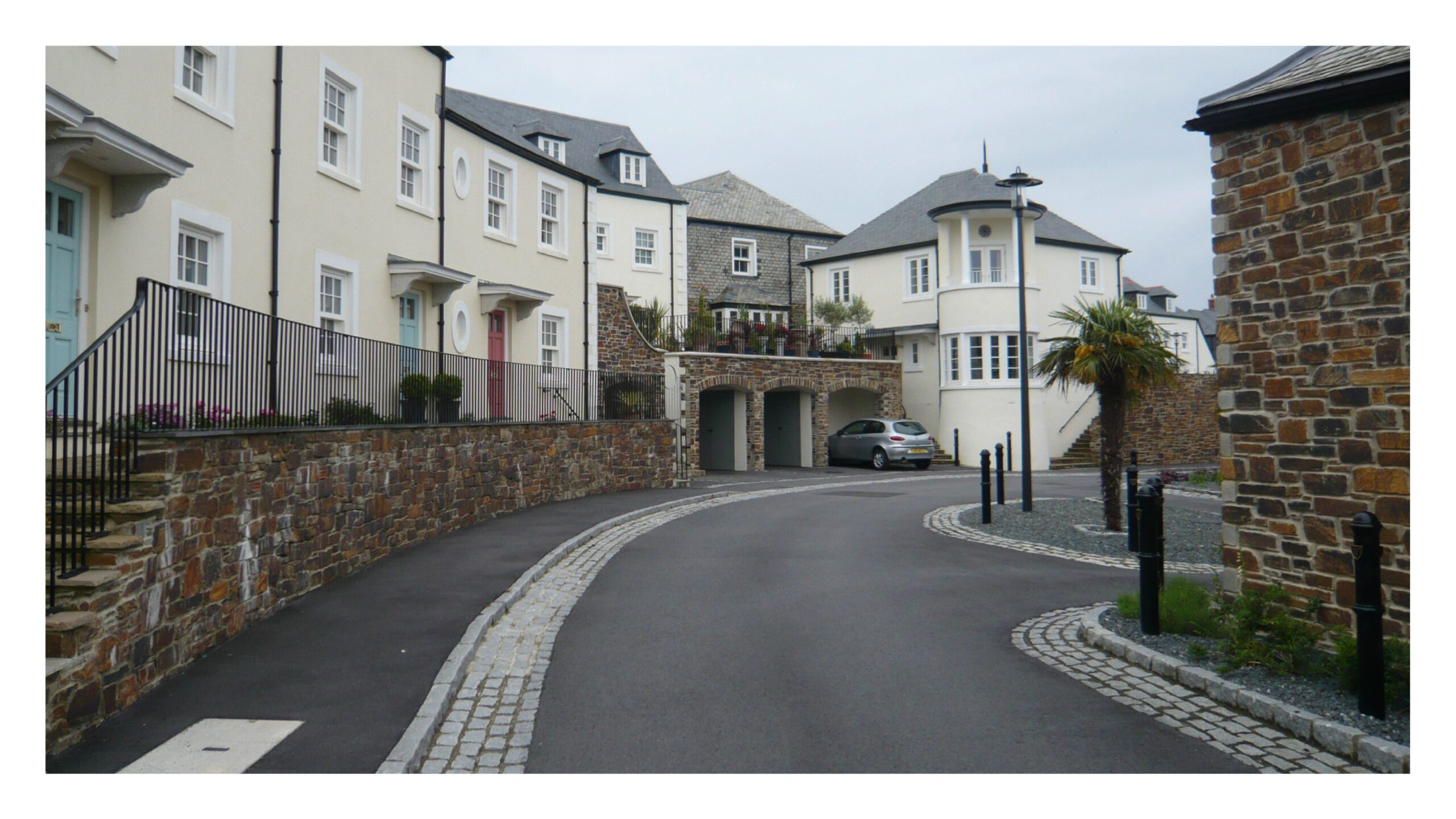 Sparing use of quality materials in combination with tarmac lifts the appearance of the street, Truro, Cornwall.