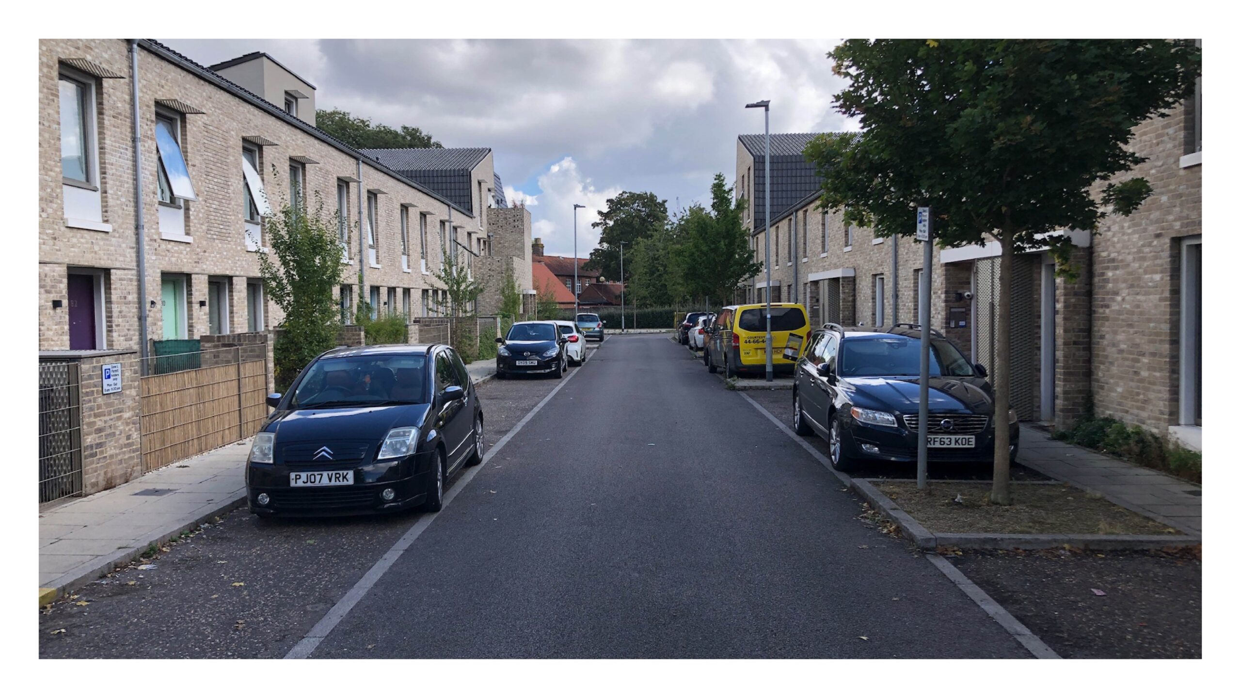 A change in material (Stone Mastic Asphalt) creates contrast between bays and carriageway, Goldsmith Street, Norwich