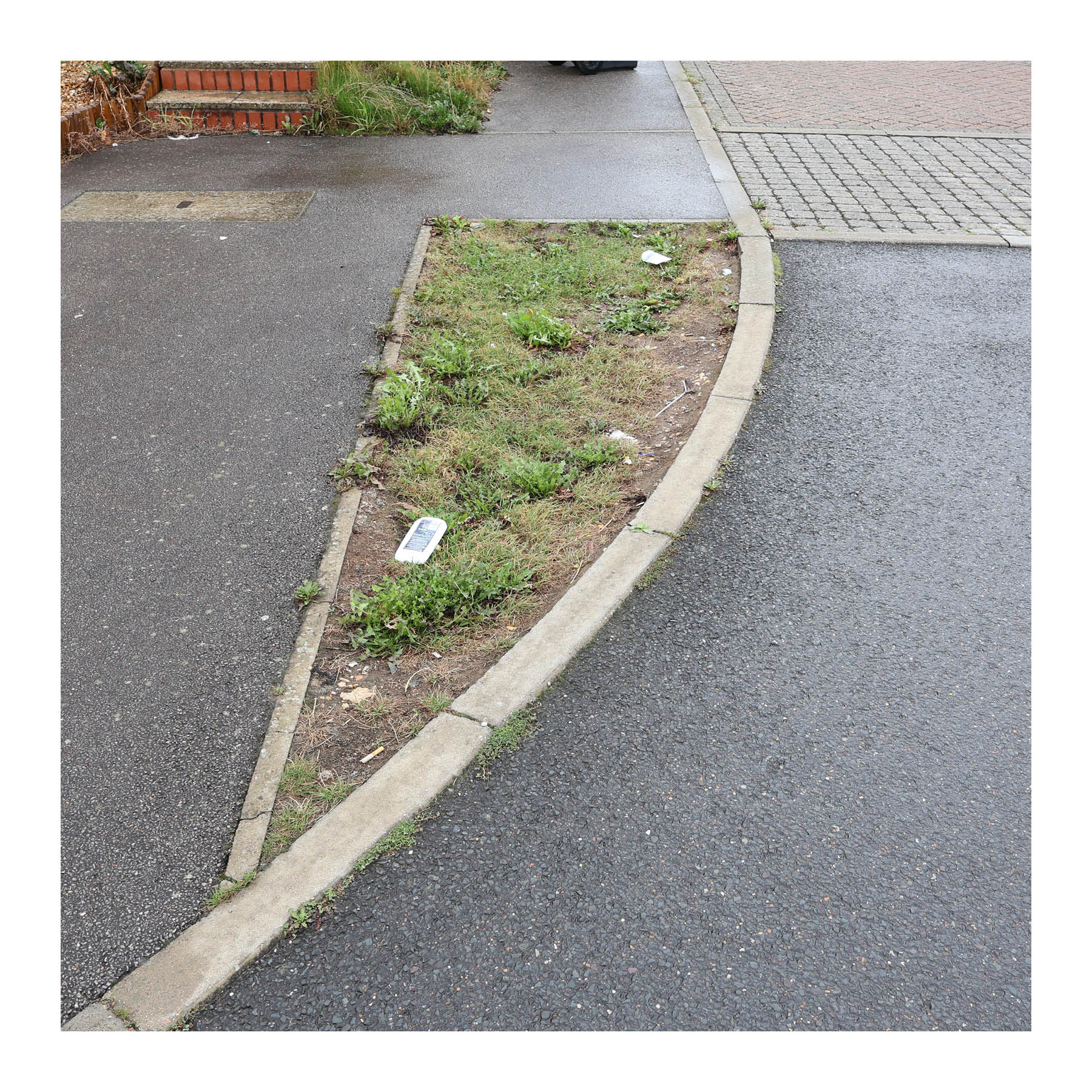 Leftover space - This could be omitted or put to better use as a tree pit.