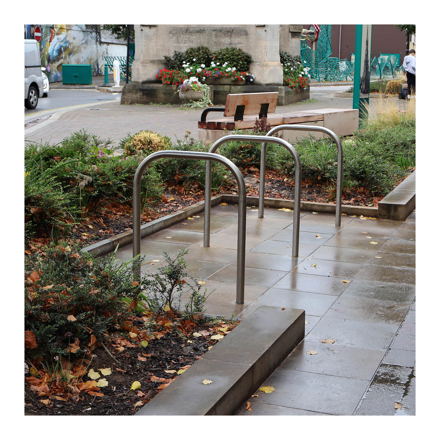 Visitor cycle parking in Sleaford, integrated with greenery and conveniently located on the High Street.