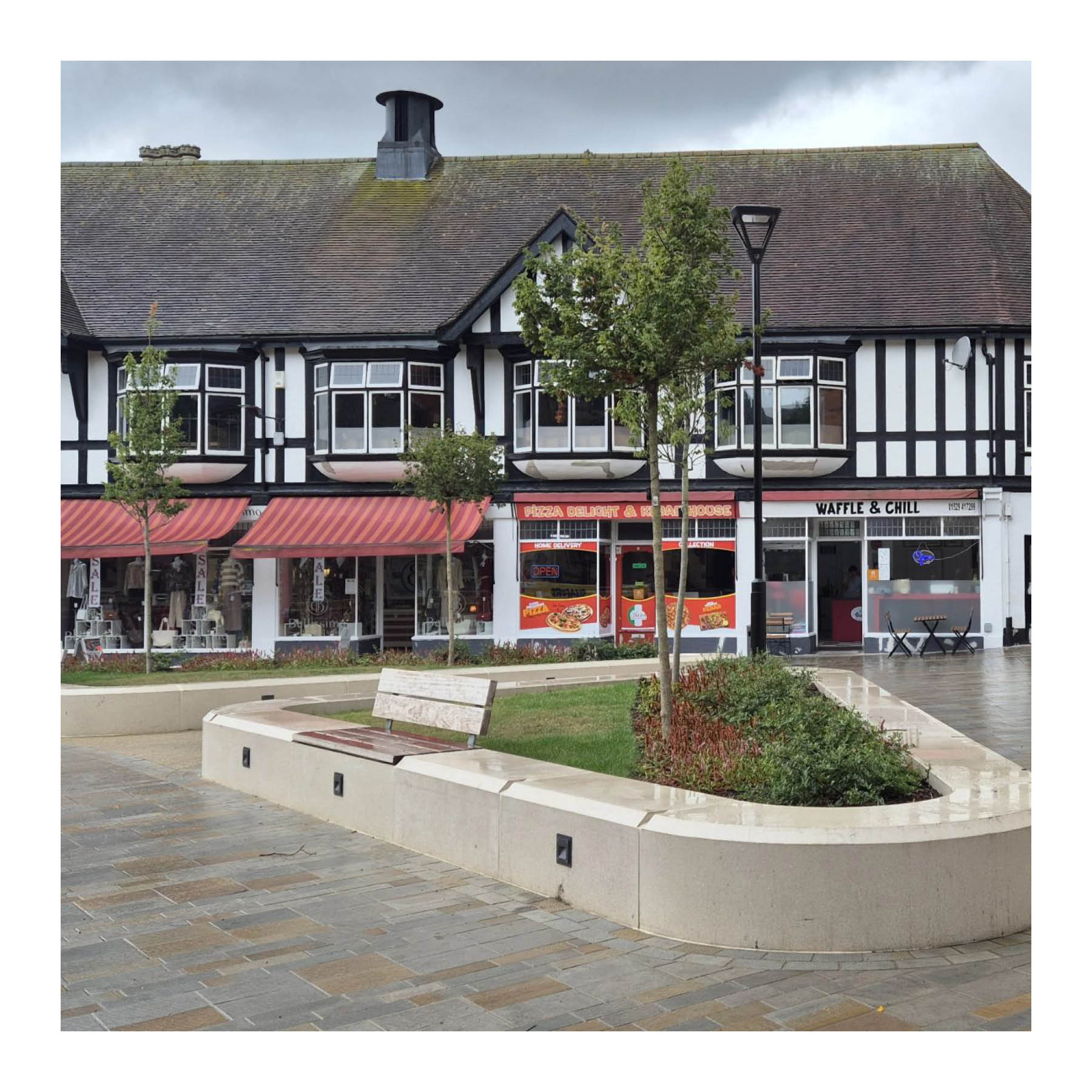 Seating integrated into planters in Sleaford