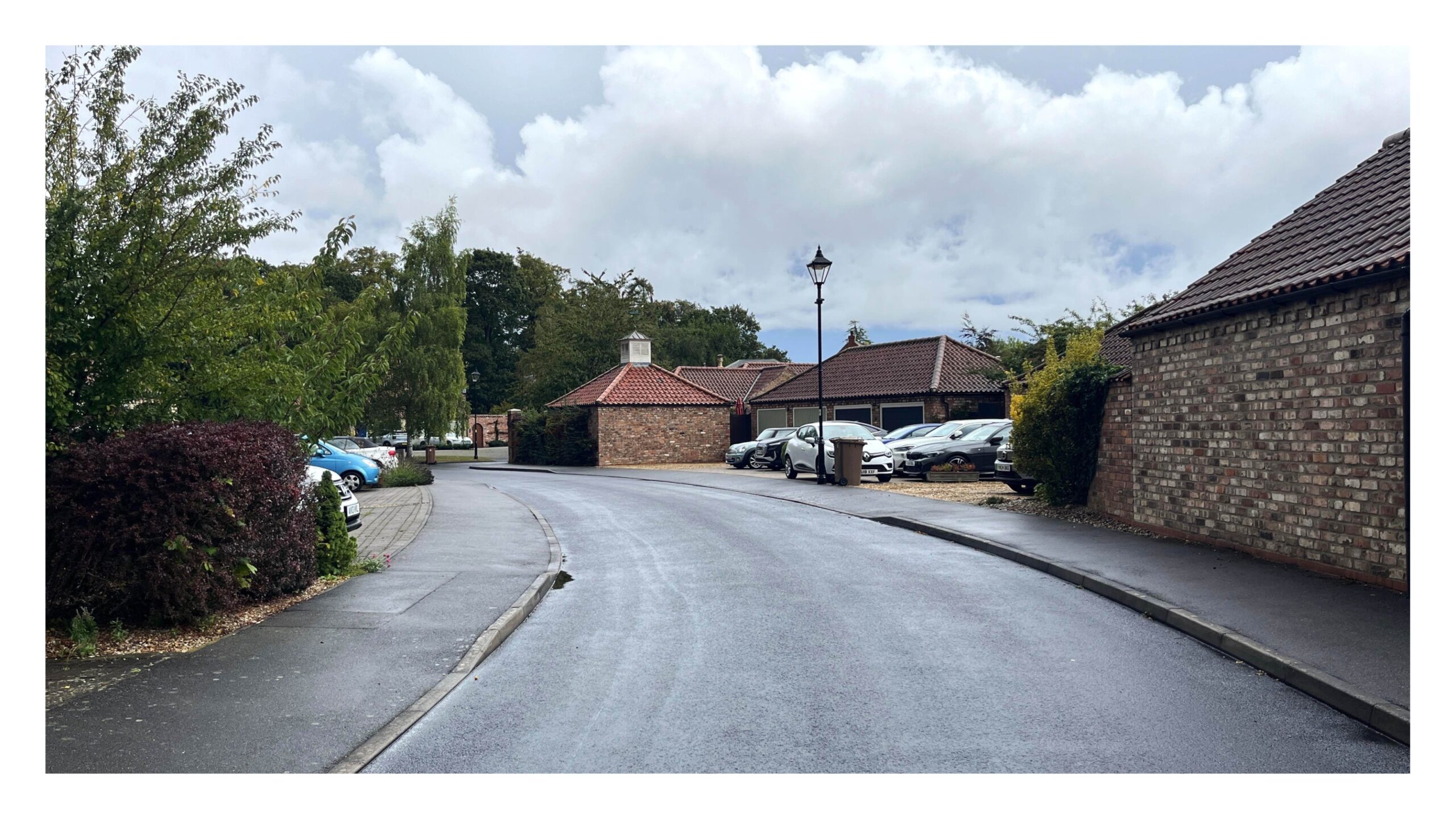 An example of a parking mews in Harmston. This street provides access to garages and parking areas, freeing up other streets from parking. It would however benefit from the inclusion of home and better paving, and one footway could be omitted.